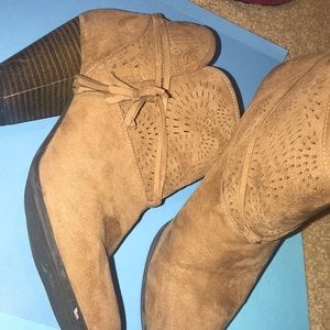 Tan booties with tassel and design